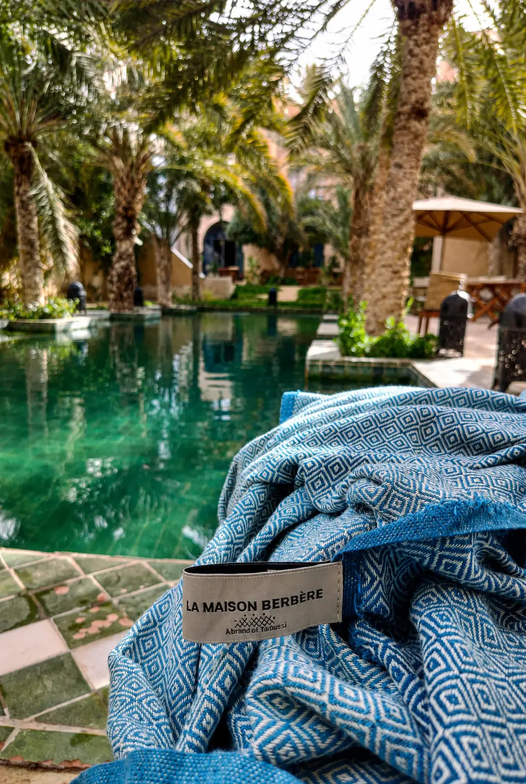 La Maison Berbère fouta beside a Mediterranean pool